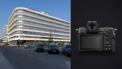 Nikon Z8 product photo beside modern white office building exterior with street view