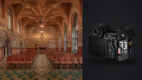 Nikon Z8 product photo beside ornate gothic hall with vaulted ceiling and rows of red chairs