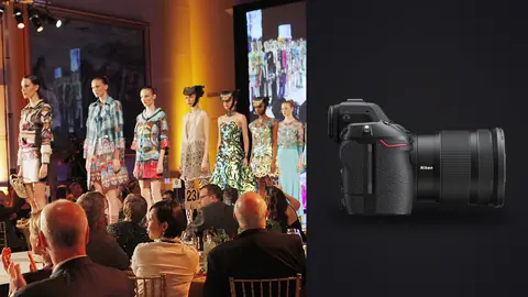 Nikon Z8 product photo beside row of models in colorful patterned outfits at an indoor runway show