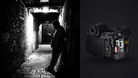 Nikon Z8 product photo beside person checking a phone in a brick archway passage