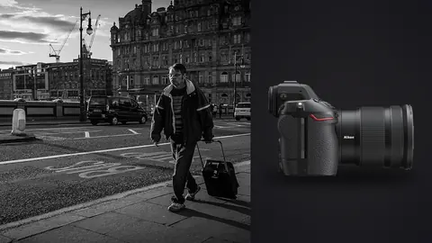 Nikon Z8 product photo beside traveler pulling a wheeled bag along a city street
