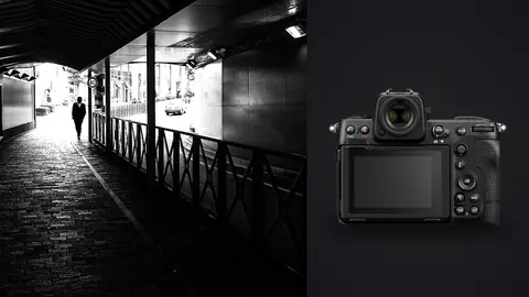 Nikon Z8 product photo beside silhouetted man walking a covered walkway toward a street
