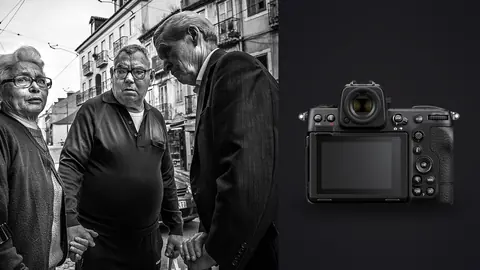 Nikon Z8 product photo beside three elderly people pausing together on a city street