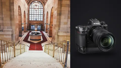Nikon Z9 product photo beside grand marble entrance hall with red carpet staircase and arched windows