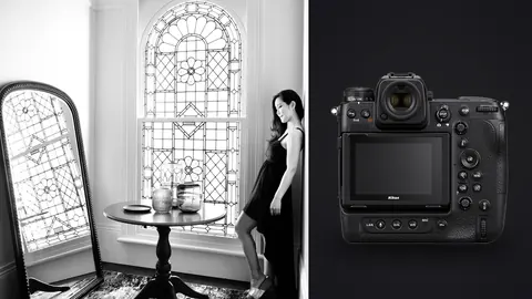 Nikon Z9 product photo beside woman in black dress by ornate stained glass window