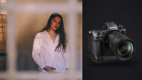 Nikon Z9 product photo beside woman in sheer blouse framed by window shutters