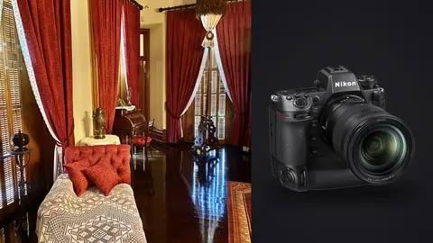 Nikon Z9 product photo beside ornate bedroom with a tufted bed and red curtains