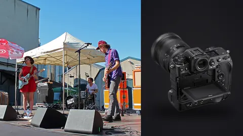 Nikon Z9 product photo beside band performing on outdoor stage in daylight