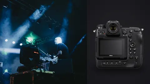 Nikon Z9 product photo beside two musicians performing on stage under blue lights