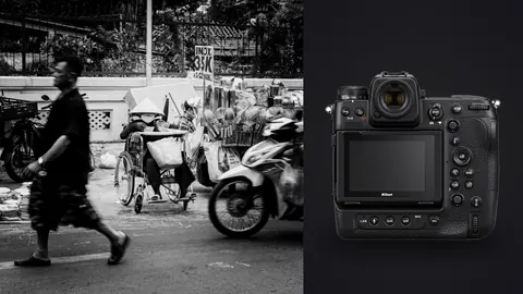 Nikon Z9 product photo beside man pushing a loaded handcart past parked scooters