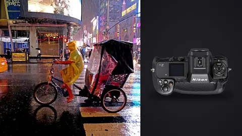Nikon Z9 product photo beside cyclist pulling a rickshaw through rain-soaked times square at night