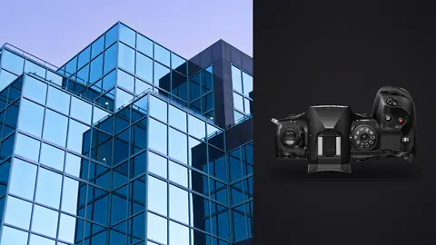 OM System OM-1 Mark II product photo beside geometric glass office building with crystalline facets