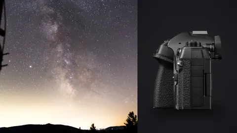 OM System OM-1 Mark II product photo beside milky way over dark hills beside dish equipment silhouette