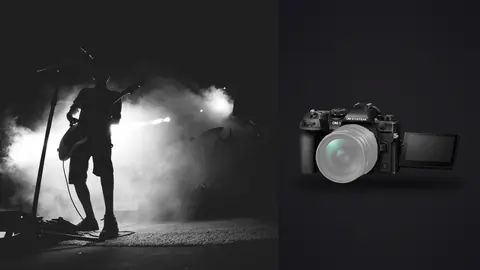 OM System OM-1 Mark II product photo beside silhouette of guitarist performing on smoky stage