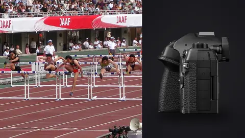 OM System OM-1 Mark II product photo beside hurdlers racing down the track with a crowd behind