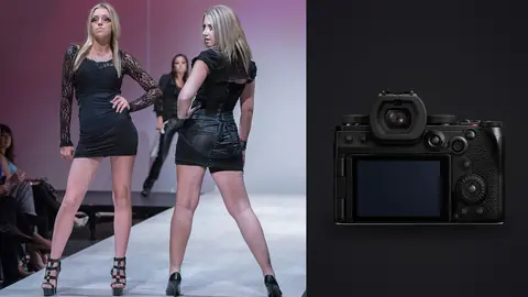 Panasonic Lumix S5IIX product photo beside two models pose together on a runway in short black dresses
