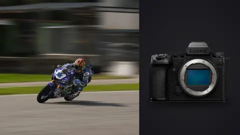 Panasonic Lumix S5IIX product photo beside motorcyclist leaning into a fast corner, motion blur
