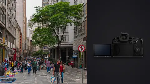 Panasonic Lumix S5IIX product photo beside crowded pedestrian street with market stalls and shoppers