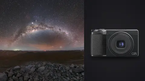 Ricoh GR IIIx product photo beside colorful milky way arch over a rocky mountain ridge