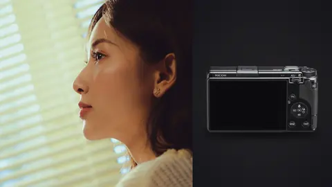 Ricoh GR IIIx product photo beside profile portrait lit through venetian blinds in knitwear