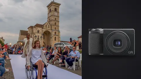 Ricoh GR IIIx product photo beside model in a wheelchair on an outdoor runway