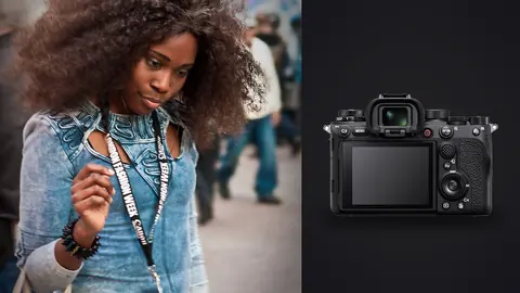 Sony Alpha 1 product photo beside woman with a large curly afro wearing an embroidered denim top