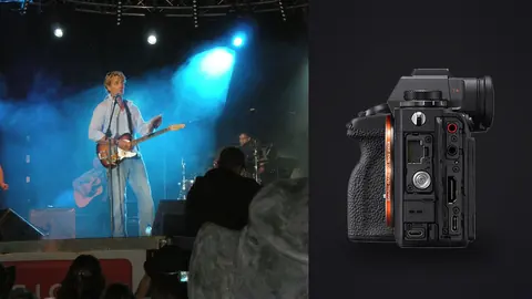 Sony Alpha 1 product photo beside guitarist performing on stage under blue lights