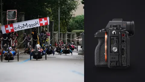 Sony Alpha 1 product photo beside handcyclists racing beneath a finish line banner