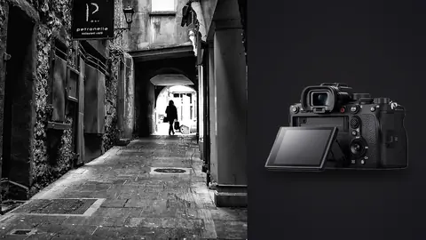 Sony Alpha 1 product photo beside silhouetted figure walking through an archway past a cafe sign