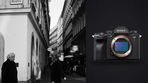 Sony Alpha 1 product photo beside pedestrians walking past historic building facades