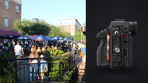 Sony Alpha 1 product photo beside diners and shoppers filling an outdoor market plaza