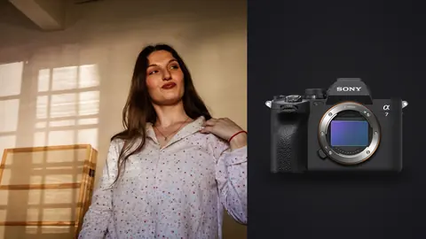 Sony a7 IV product photo beside woman in floral pajama shirt in warm light