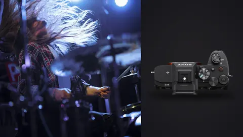 Sony a7 IV product photo beside drummer performing energetically on stage