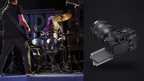 Sony a7 IV product photo beside band performs on stage during a live music event