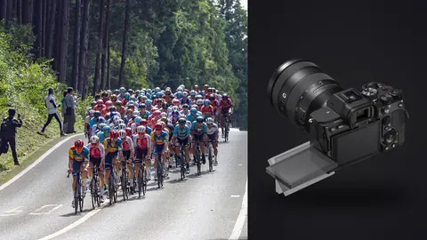 Sony a7 IV product photo beside large cycling peloton riding through a forested mountain road