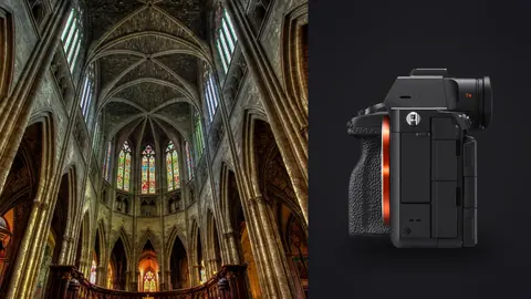 Sony a7R V product photo beside gothic cathedral interior with soaring vaulted ceiling and stained glass