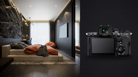 Sony a7R V product photo beside modern bedroom with stone wall and orange throw