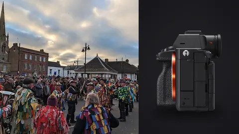 Sony a7R V product photo beside costumed folk dancers performing before a market square crowd