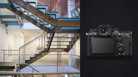 Sony a9 III product photo beside modern glass and steel staircase in gallery space
