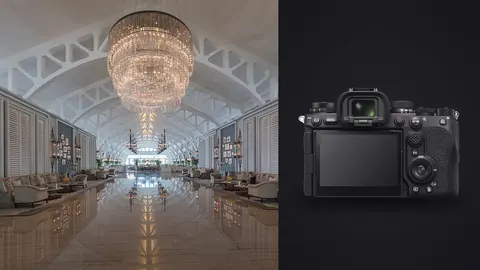Sony a9 III product photo beside grand hotel lobby with chandelier and seating area