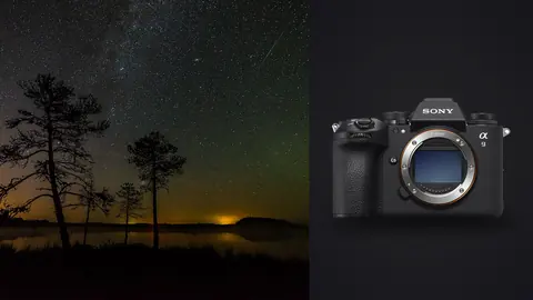 Sony a9 III product photo beside faint milky way and aurora glow behind two silhouetted pines