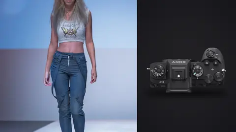 Sony a9 III product photo beside model in a silver top and jeans wearing a gold headpiece