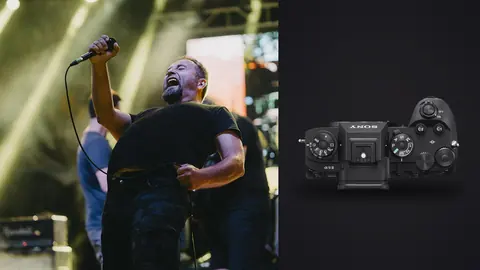Sony a9 III product photo beside singer performing passionately on stage
