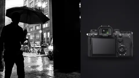 Sony a9 III product photo beside silhouetted figure with an umbrella on a rainy night street