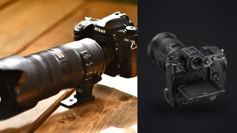 Nikon Z9 product photo beside nikon camera fitted with a long telephoto lens on a wooden table