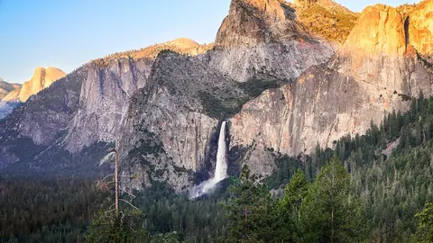 Golden hour light on Yosemite granite cliffs with Bridalveil Fall